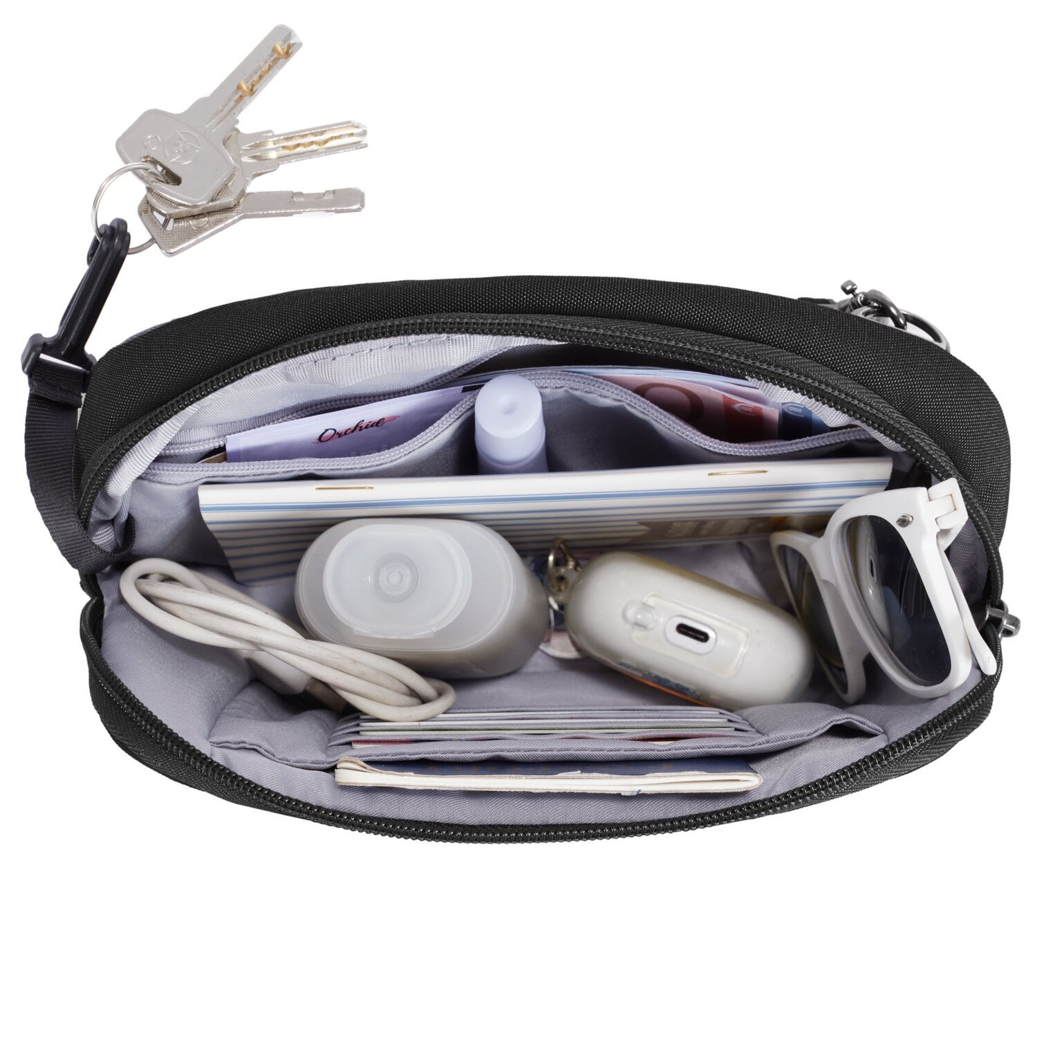 Hoofdvak van de Travelon Metro Convertible Crossbody met oortjes, powerbank en sleutelclip