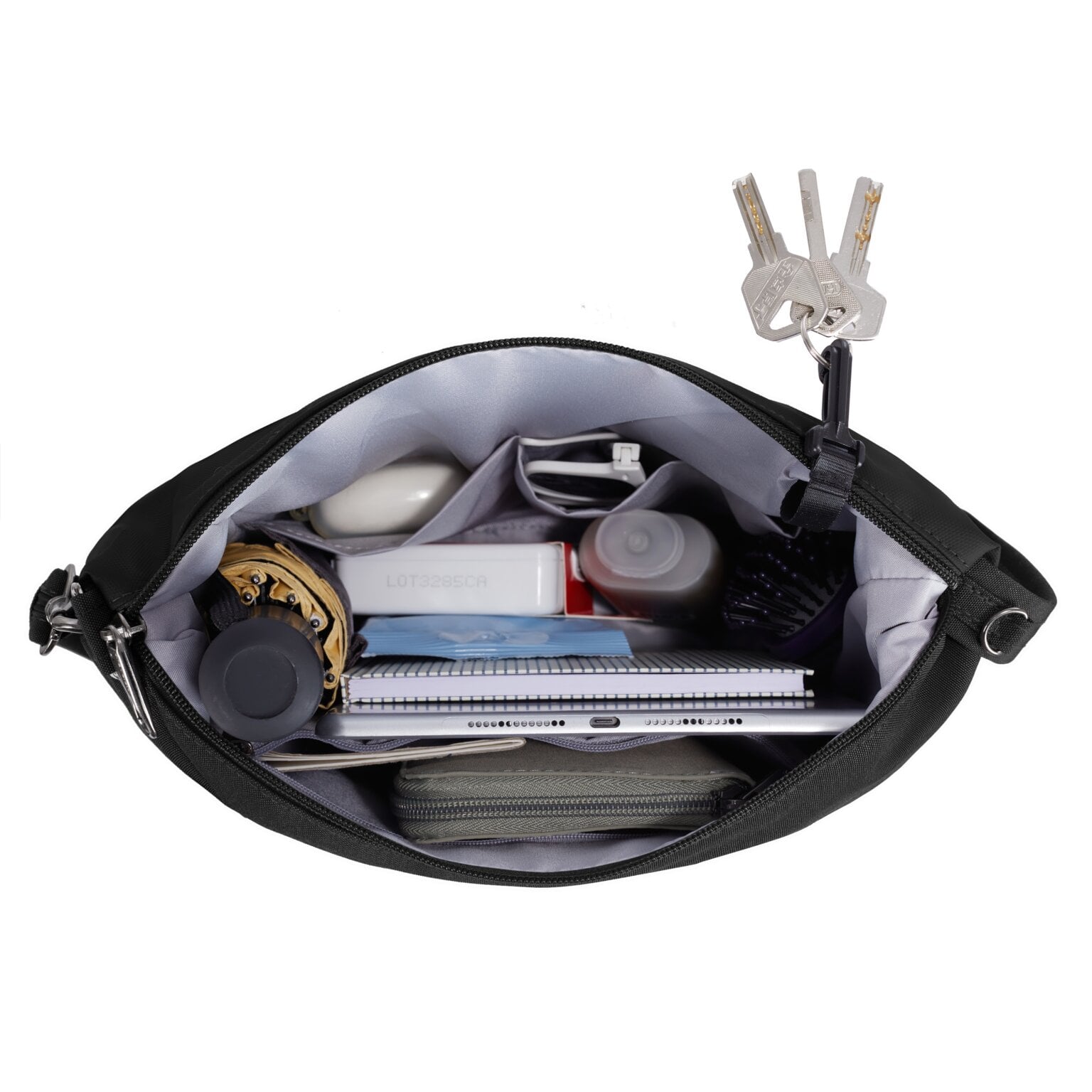 Hoofdvak van de Travelon Metro Crossbody M met notitieboek en sleutelclip