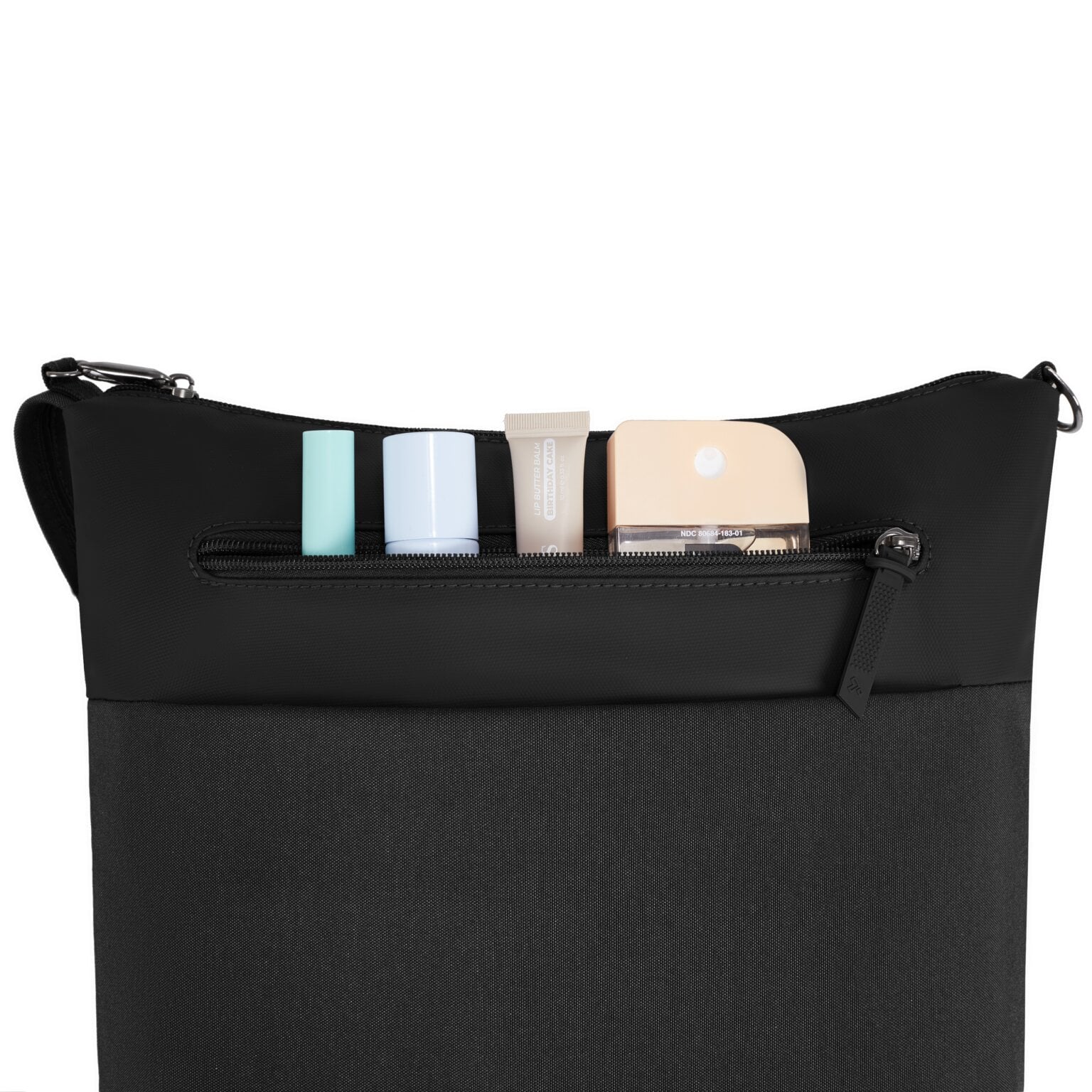Voorvak van de Travelon Metro Crossbody M met cosmetica