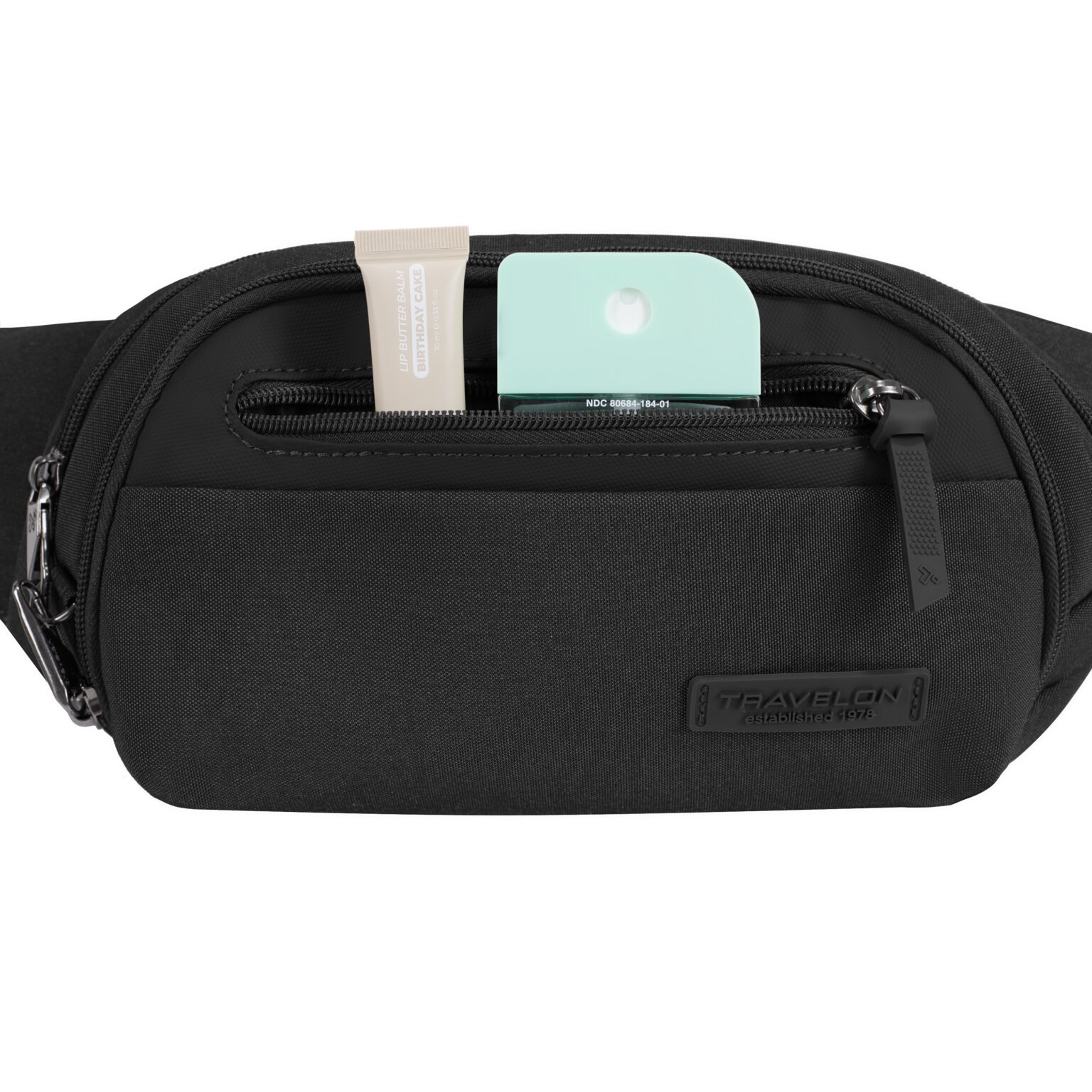 Voorvak van de Travelon Metro Waistpack met powerbank en lipbalsem