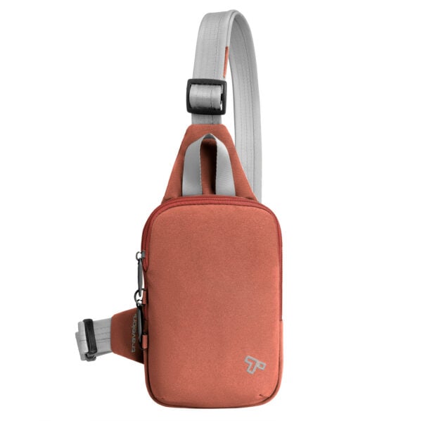 Travelon Voyages anti-diefstal compact sling in koraal van voren met verstelbare band