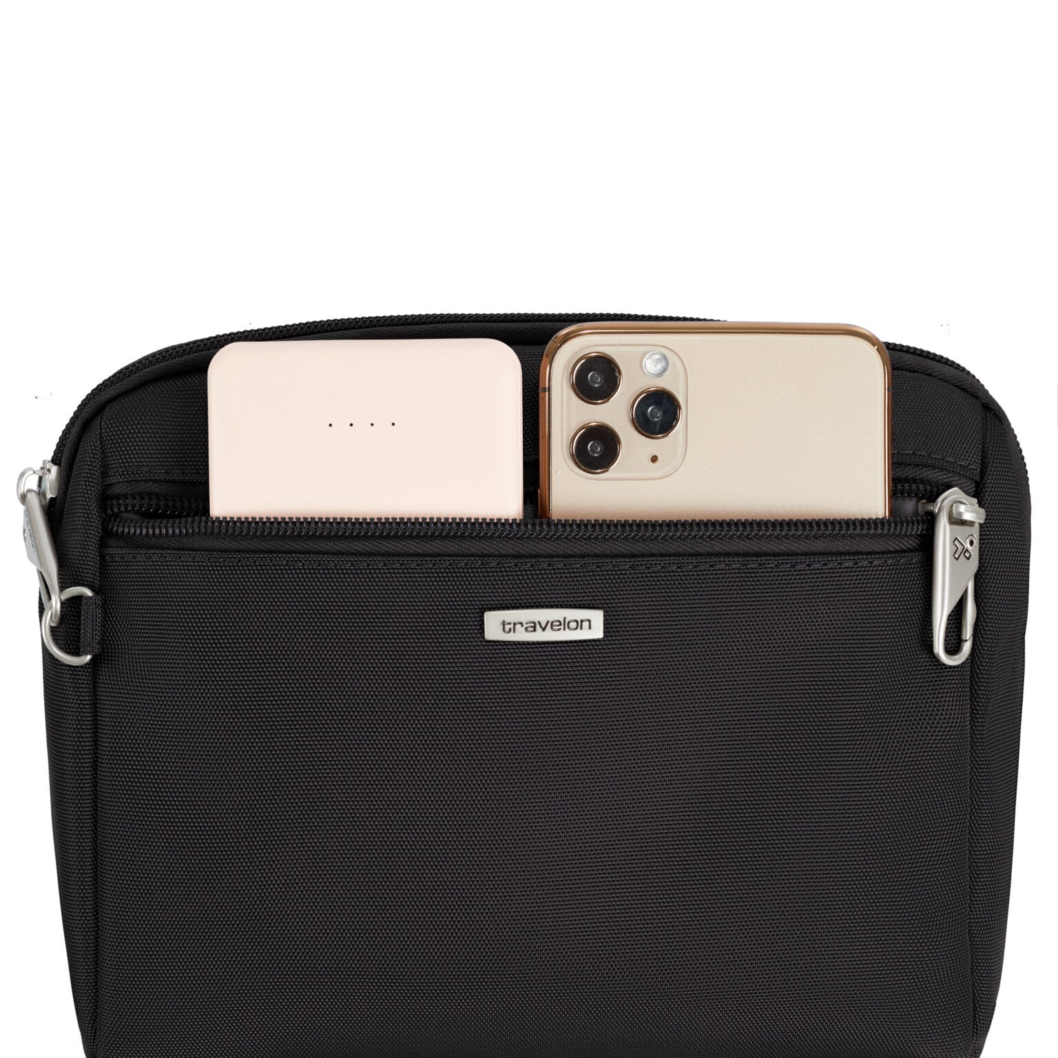 Achtervak van de Travelon Classic kleine crossbody of heuptas in zwart met telefoon en powerbank