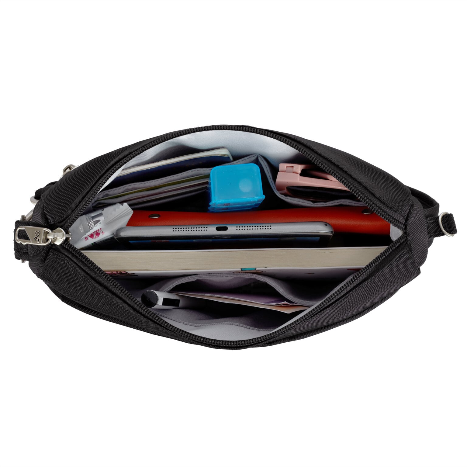 Hoofdvak van de Travelon Classic kleine crossbody tas in zwart met tablet, documenten en oortjes