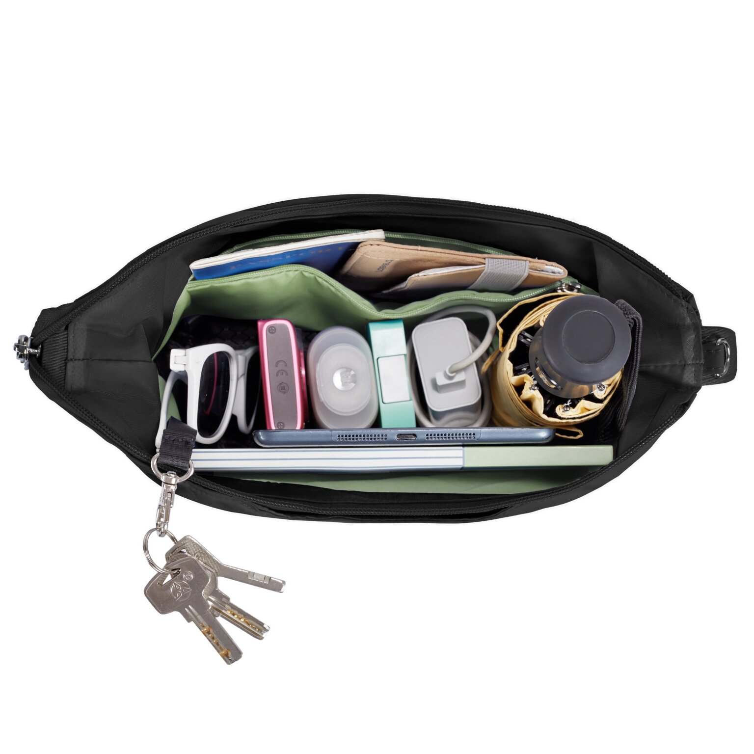 Hoofdvak van de Travelon Roam medium crossbody tas in zwart met sleutels, oortjes en zonnebril